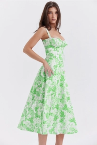 Close-up detail of green floral print and corset waist design on summer slip dress