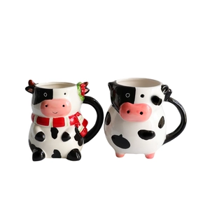 3D ceramic cow coffee mugs with cute cartoon designs in black, white and red colors