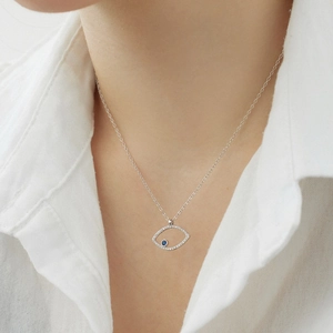 Close-up of S925 sterling silver evil eye necklace with blue stone and pavé zircons