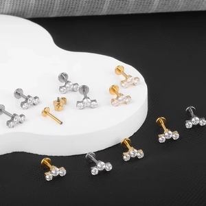 G23 titanium flower labret stud with three zirconia stones in gold and silver finish