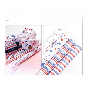 Detail showing various birthday gift wrapping paper rolls with festive star and stripe patterns