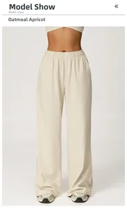 Close-up of high-waist drawstring waistband on oatmeal apricot wide-leg joggers