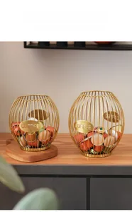 Detailed view of gold wire coffee pod baskets with metal COFFEE labels on wooden surface
