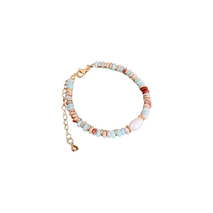 Elegant gold-plated geometric necklace with blue beads and a central baroque pearl
