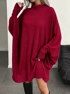 Detail of burgundy ribbed knit turtleneck sweater showing thick texture and drop shoulder