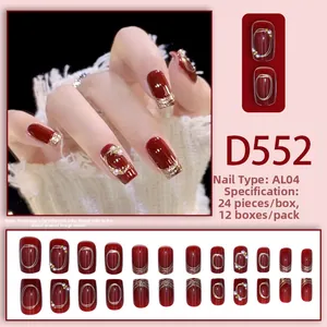 Detail of burgundy press-on nails with gold foil, pearls and 24-piece full set layout