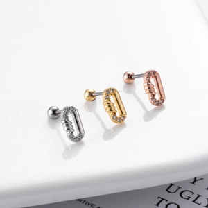 Detail of dragonfly crescent ear studs in silver, gold, and rose gold with zircon inlay