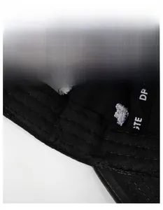 Detail of internal moisture-wicking sweatband and reinforced stitching on black baseball cap
