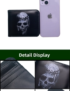 Detail view of black skull wallet showing internal zipper pocket and card slots