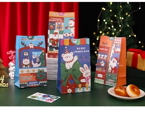 Detailed view of Christmas themed paper gift bags with festive seals and warm lighting