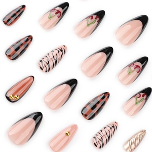 Almond fake nails featuring 3D cherry designs, zebra patterns and black French tips