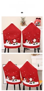 Detail of Christmas chair covers featuring Santa and Snowman motifs on red non-woven fabric
