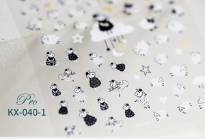 Detailed view of KX-040-1 nail stickers featuring black and white cartoon sheep and stars
