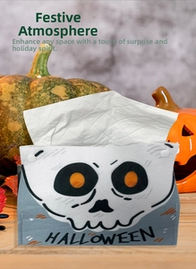 Detail of grey Halloween tissue box cover with skull print and pumpkin backdrop