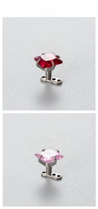 Detailed macro view of 6mm square zircon microdermal anchors in red and pink colors