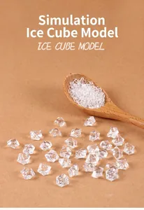 Detail of irregular acrylic ice cubes with a wooden spoon on warm kraft paper background