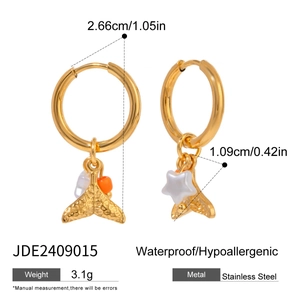 Detail of gold stainless steel fish tail and star earrings with size measurements