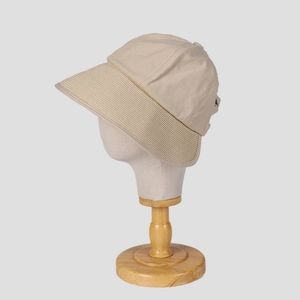 Detail of reinforced wide brim with parallel stitching on beige cotton sun hat