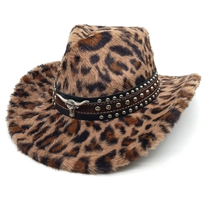 Detail of leopard print western cowboy hat with silver bull head and studded leather band