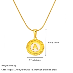 Detailed view of 18k gold pendant with white enamel letter A and product dimensions