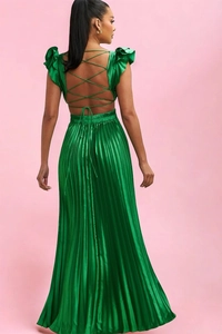 Detail of backless green satin maxi dress with criss-cross straps and pleated skirt