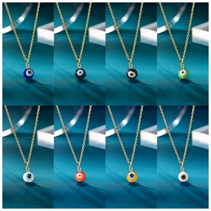 Golden necklace collection featuring diverse evil eye spherical pendants in eight vibrant colors