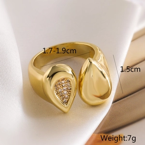 Macro shot of gold plated irregular open ring with zircon inlay and product dimensions