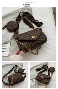 Detail of coffee brown quilted PU leather handbag with gold hardware and wide strap