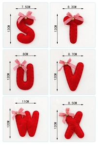 Detail view of red felt Christmas alphabet letters with bells and bows, height 12cm
