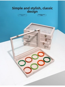 Detailed internal 8-slot jewelry box view featuring soft velvet lining and clear glass lid
