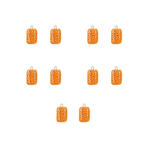 Macro detail of 10 orange resin food charms with realistic porous texture and metal hooks