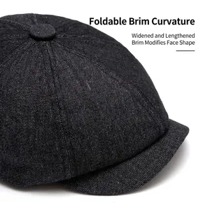 Deep grey denim newsboy cap featuring foldable wide brim and octagonal crown design