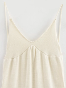 Elegant cream knit camisole dress with V-neckline and intricate woven texture detail