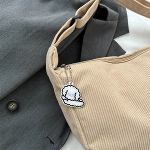 Corduroy dumpling shoulder bag in beige with a cute cloud pendant for daily casual style