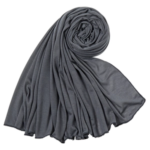 Detail of soft dark grey jersey hijab featuring fine overlock stitched edges and draping texture