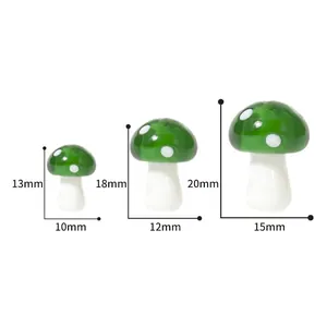 Three sizes of green glass mushroom beads with white polka dots for DIY jewelry