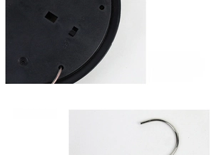 Detail of Halloween pumpkin wind chime solar panel with ON/OFF switch and metal S-hook