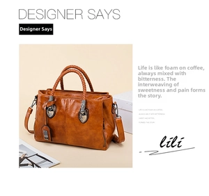 Close-up of caramel leather Boston bag featuring woven handles and metal hardware