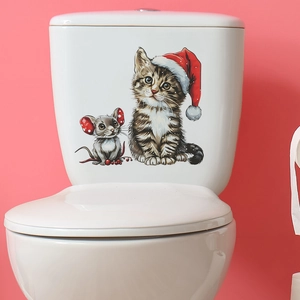 Detailed view of Christmas cat and mouse waterproof PVC sticker on white ceramic toilet tank