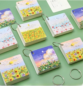 Detailed macro view of oil painting style mini spiral notebooks with metal ring binders
