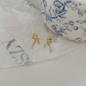 Elegant 925 silver gold bow earrings with micro-zirconia in a minimalist style