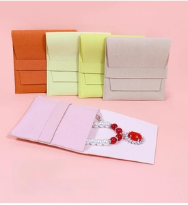 Microfiber envelope jewelry pouches in five vibrant colors with ribbon drawstring closure