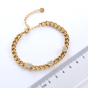 Elegant gold chain bracelet with three sparkling heart pendants and size measurement
