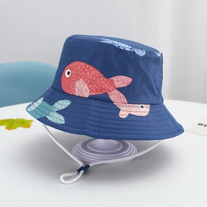 Detail of dark blue kids sun hat featuring colorful fish prints and adjustable chin strap