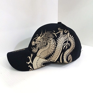 Classic black baseball cap with intricate gold dragon embroidery on the side and brim