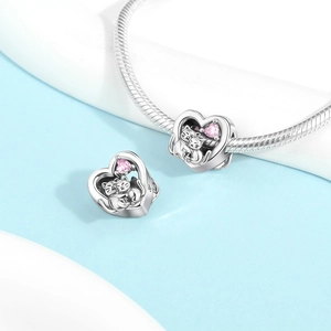 Detail of silver cat heart charm with pink cubic zirconia on a beaded bracelet
