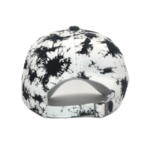 Tie-dye graffiti baseball cap in black and white ink splash design with adjustable strap