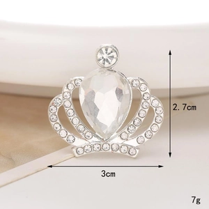 Macro shot of silver crown shoe charm with rhinestones and precise size measurements
