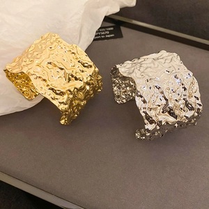 Artistic hammered texture wide metal bangles in gold and silver finish with open design