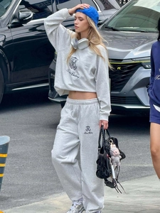 Close-up of grey sweatshirt set with Sweet Chilling embroidery and casual high waist pants